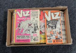 A box containing vintage Viz comics.