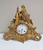 An antique French gilt mantel clock signed Laine A Paris, with enamelled dial,