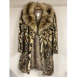 An early 20th century lady's 3/4 length ocelot fur coat.