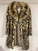 An early 20th century lady's 3/4 length ocelot fur coat.