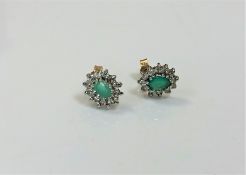 A pair of 9ct gold emerald cluster earrings. CONDITION REPORT: 1.