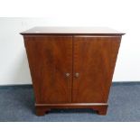 An inlaid mahogany double door storage cabinet,