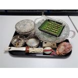 A tray of plated coasters and pair of wine coasters, cameo carved shell, continental silver spoons,