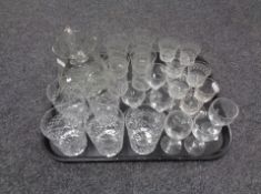 A tray of early twentieth century and later glass, etched glass jug and beakers,