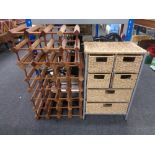 A metal and wicker six drawer chest together with two wooden wine racks.