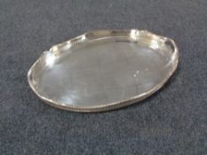 An antique silver plated twin handled gallery tray, width 56 cm.