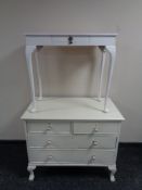 A painted Edwardian four drawer chest on claw and ball feet with ceramic handles,