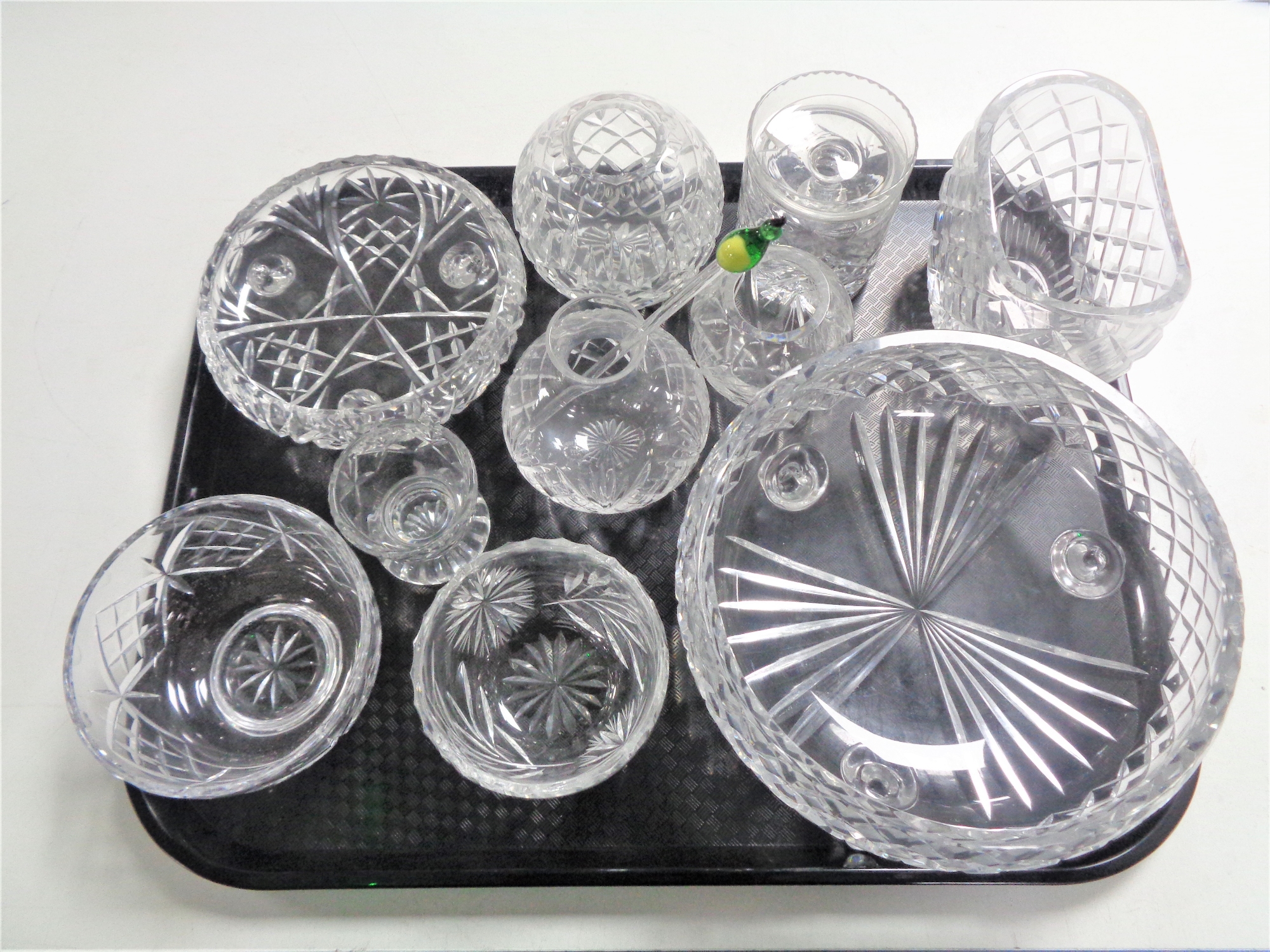 A tray containing cut glass lead crystal vases, bowls and dishes.