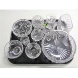 A tray containing cut glass lead crystal vases, bowls and dishes.