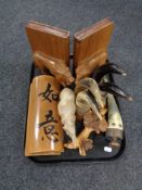 A tray of pair of wooden lion bookends, carved wooden figure of a rhinoceros,