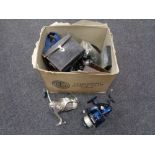 A box of fishing equipment to include assorted reels,