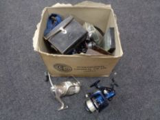 A box of fishing equipment to include assorted reels,