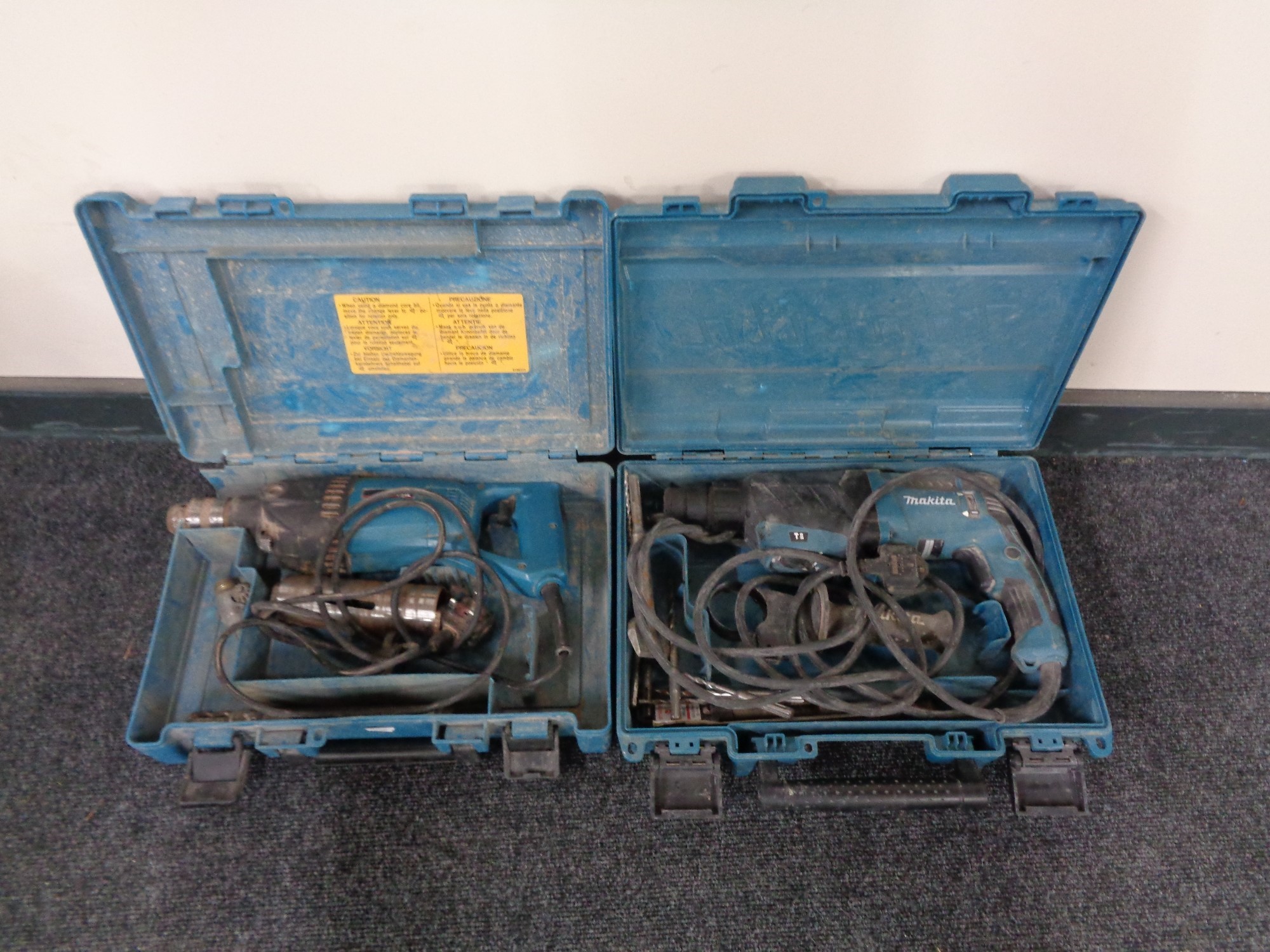 Two cased Makita electric drills
