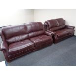 A Wade Additions Burgundy leather three seater settee with matching two seater settee.