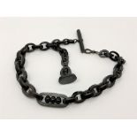 A Victorian vulcanite Albert chain with T-bar,