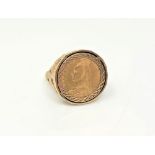 A gent's 9ct gold ring set with a Victorian half sovereign, size W.