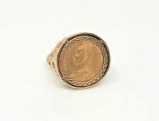 A gent's 9ct gold ring set with a Victorian half sovereign, size W.