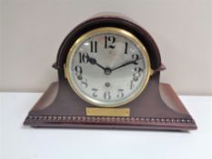 An early twentieth century mahogany cased German presentation mantel clock with silvered dial