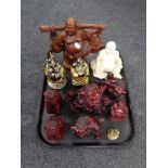 A tray of resin figures of Buddhas and foo dogs