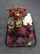 A tray of resin figures of Buddhas and foo dogs