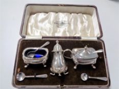 A boxed silver cruet set