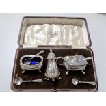 A boxed silver cruet set