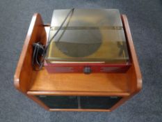 A Radilva turntable on stand fitted with a pair of Philips speakers