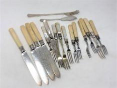 A collection of knives and forks with ivory/mother of pearl handles,