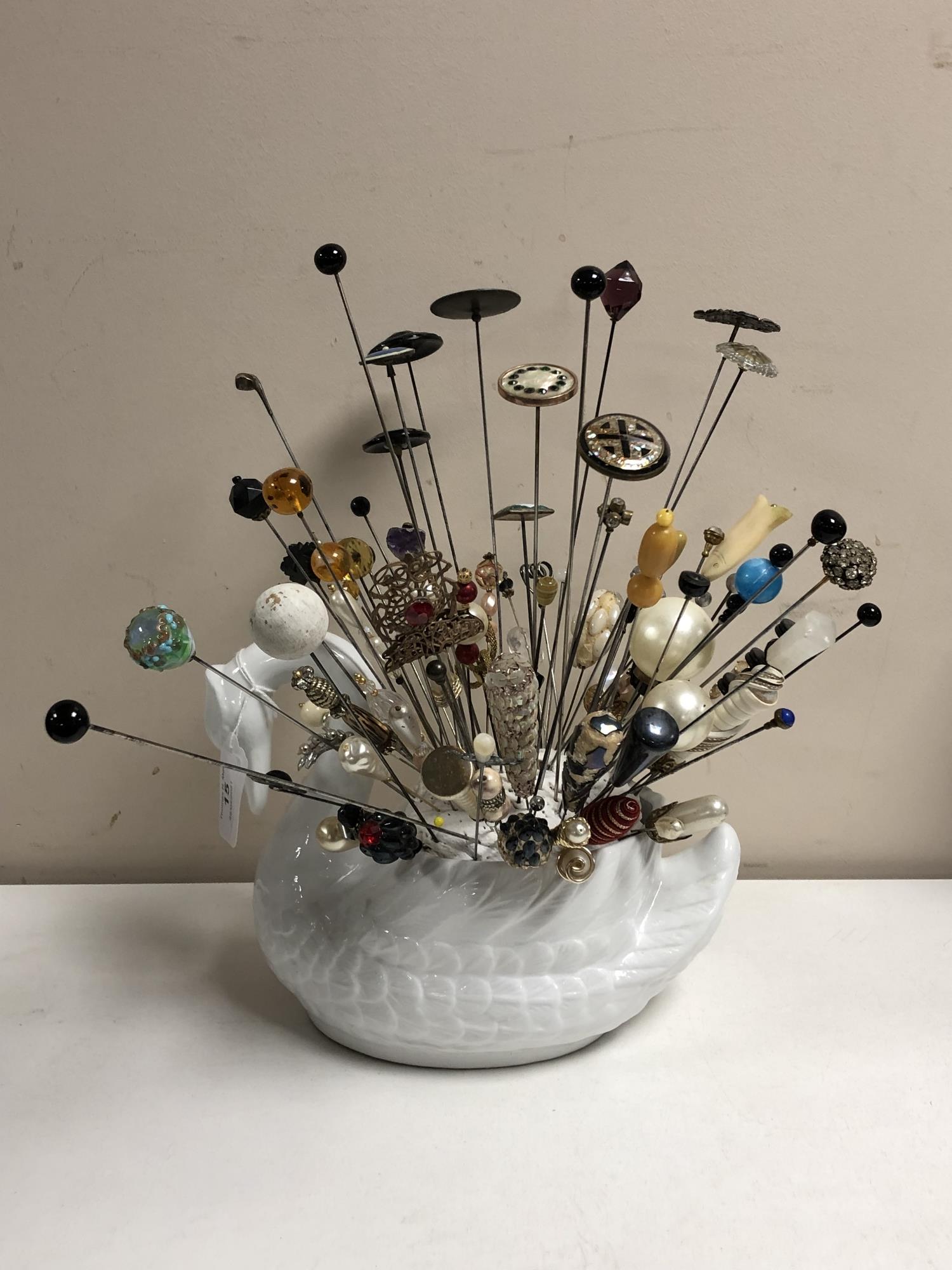 A collection of nearly one hundred stick pins and hat pins, some silver examples,