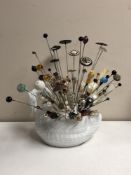 A collection of nearly one hundred stick pins and hat pins, some silver examples,