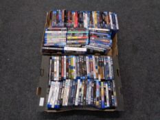 Two boxes containing a large quantity of blu ray movies.