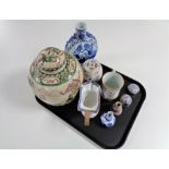 A tray of antique and later Oriental wares, wicker handled blue and white jug (a/f), ginger jar,