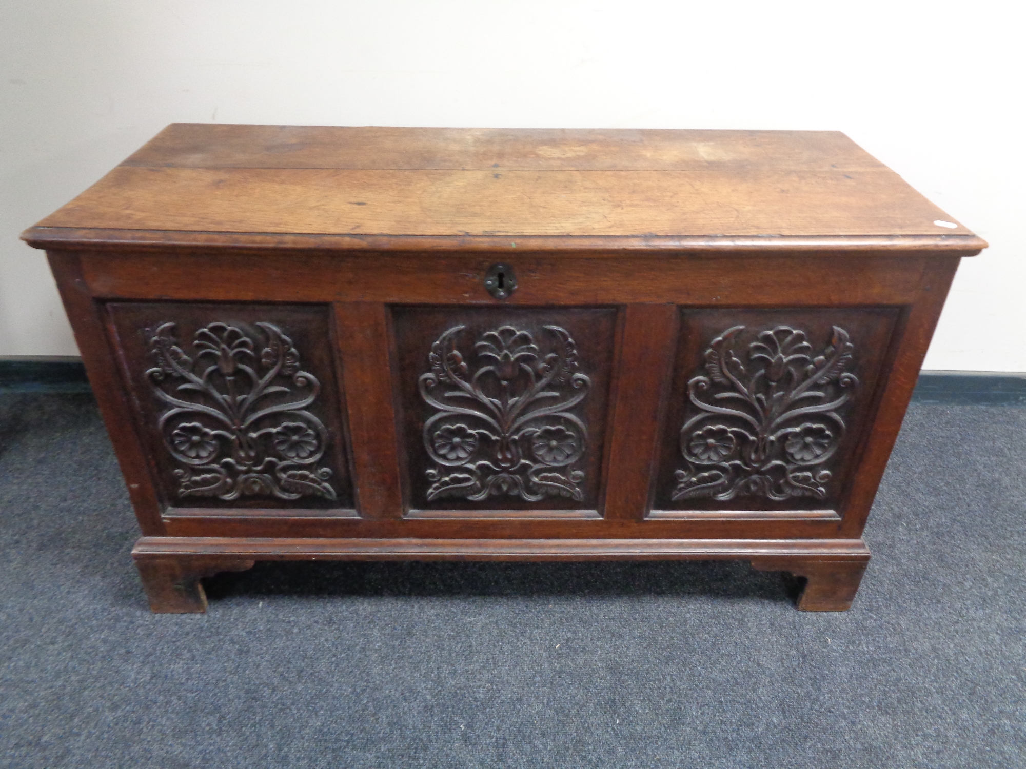 A 19th century carved oak coffer.