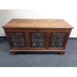A 19th century carved oak coffer.