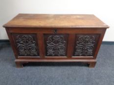 A 19th century carved oak coffer.