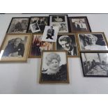 A box of framed and unframed autographed pictures to include Rowan Atkinson, Joe Brown,