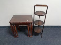 A nest of three mahogany glass top tables, together with a mahogany three tier folding cake stand.
