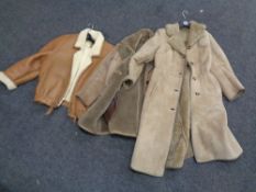 Three sheepskin coats.