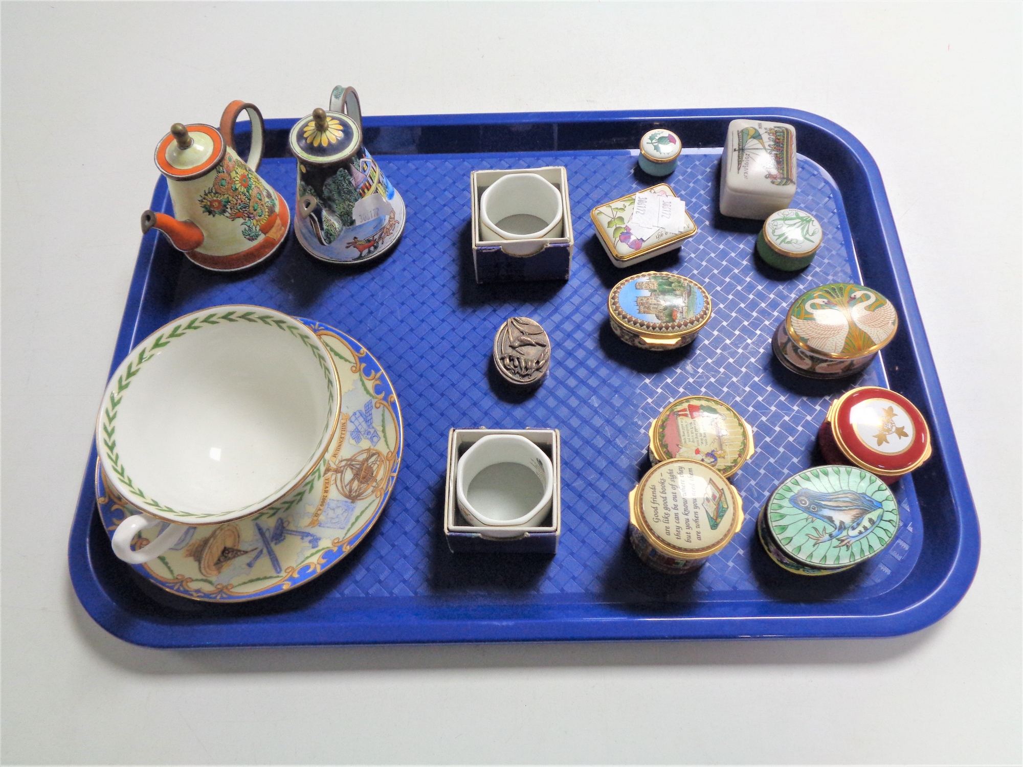 A tray containing miscellaneous items to include Halcyon Days enamel pill and trinket boxes,