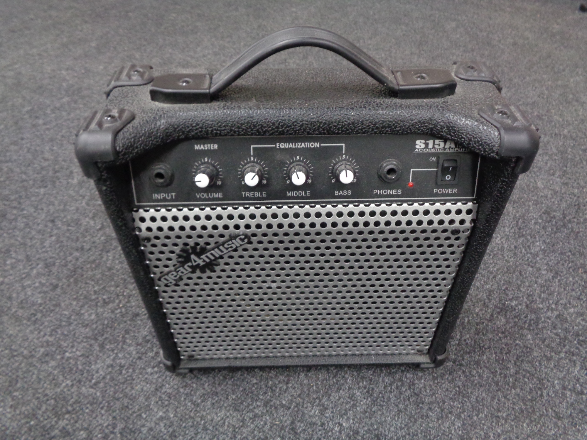 A Gear4Music S15A acoustic guitar amplifier.