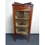 A 19th century inlaid corner display cabinet with glazed door.