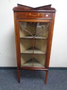 A 19th century inlaid corner display cabinet with glazed door.