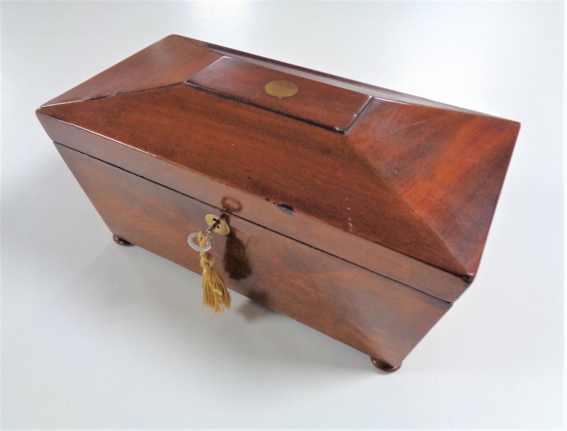 A Georgian mahogany fitted tea caddy with key