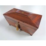 A Georgian mahogany fitted tea caddy with key