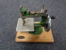 A mid century child's grain sewing machine