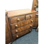 A Victorian mahogany five drawer chest.