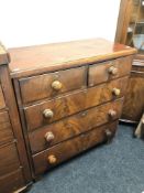 A Victorian mahogany five drawer chest.