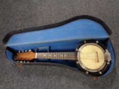 An eight-string banjolele by John Gray and Sons of London, in fitted case.
