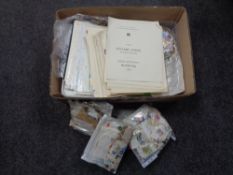 A box containing a large quantity of 20th century world stamps, loose and on sheets.