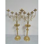 A pair of decorative brass five way candelabra, height 71.5 cm.